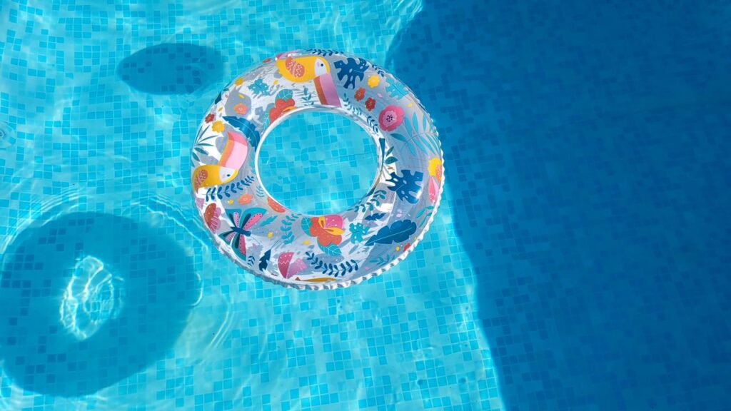 The Art of Drawing Readers In: Your attractive post title goes here Vibrant inflatable swim ring floating in a sunlit pool, perfect for summer fun.